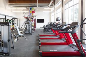 Dallas apartment for rent - A gym with treadmills and exercise equipment.