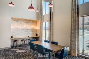 Austin apartment for rent - A conference room with a long table and chairs.