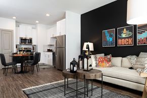 Austin apartment for rent - A modern kitchen with a dining table and chairs.