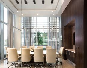 Frisco apartment for rent - A conference room with a long table and chairs.