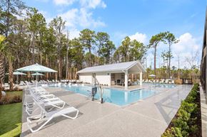Wilmington apartment for rent - A pool area with sun loungers and a pavilion.