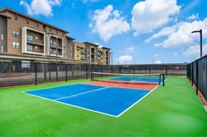 Denton apartment for rent - A tennis court at the Vista at Razyor Ranch in Denton Texas