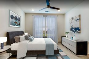 Denton apartment for rent - A bedroom with a bed at the Vista at Razyor Ranch in Denton Texas