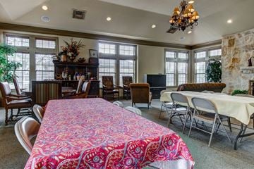 San Antonio apartment for rent - A dining room with a table covered in a red and pink tablecloth.