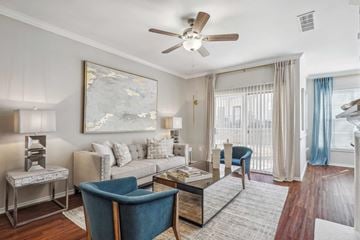 Grapevine apartment for rent - A living room with a blue chair and a painting on the wall.