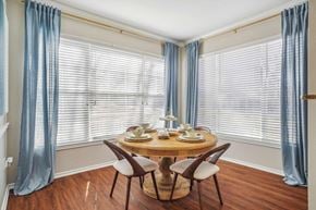 Grapevine apartment for rent - A dining room with a round table and chairs.