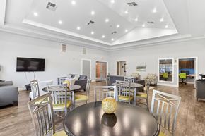Dallas apartment for rent - A modern dining room with a large table and chairs.