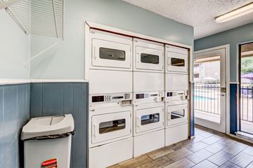 Longview apartment for rent - A row of white ovens are lined up in a kitchen.