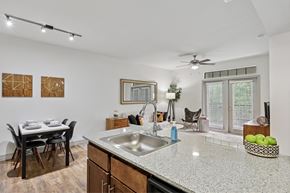 Austin apartment for rent - A kitchen with a dining table and chairs.