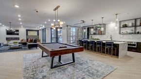 Pittsburgh apartment for rent - A pool table is in the middle of the community club room at The Artisan at Robinson