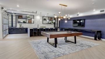 Pittsburgh apartment for rent - A modern living room with a wooden table and a television.