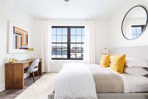 Ridgewood apartment for rent - A bedroom with a large bed and a desk with a chair.