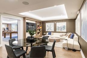 Ridgewood apartment for rent - A modern dining room with a glass table and chairs.
