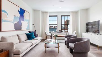 Ridgewood apartment for rent - A living room with a large painting on the wall and a flat screen TV.