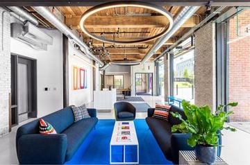 Charlestown apartment for rent - A modern living room with a blue couch and a coffee table.
