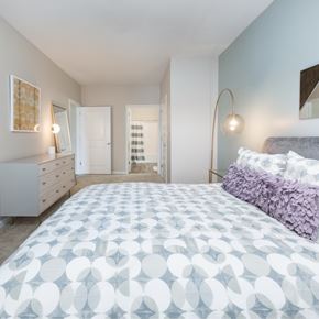 Wilmington apartment for rent - A bedroom with a large bed and a dresser.