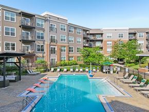 Upper St Clair apartment for rent - 3-Bedroom Luxury Apartments In Upper St. Clair, PA - Ashby At South Hills Village Station - A Large Outdoor Swimming Pool Surrounded By Lounge Seating.