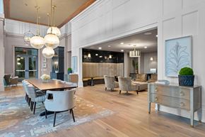 Charleston apartment for rent - A modern dining room with a wooden table and chairs.