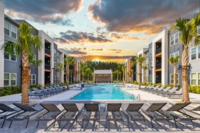 Summerville apartment for rent - Exterior view of The Ames apartment community pool and buildings