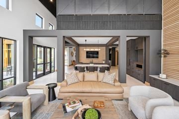 Summerville apartment for rent - A modern living room with a grey sofa and a wooden coffee table.