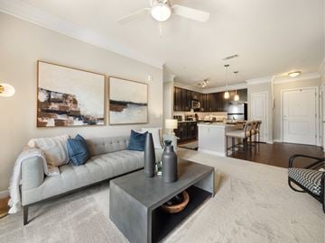 Cranberry apartment for rent - A living room with a grey sofa and a coffee table.