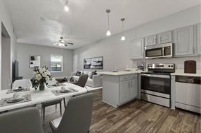 Mckinney apartment for rent - a kitchen with a table and chairs at Towns at Chapel Hill in Plano Texas