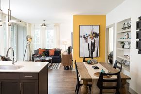 Austin apartment for rent - A modern kitchen with a wooden table and chairs.