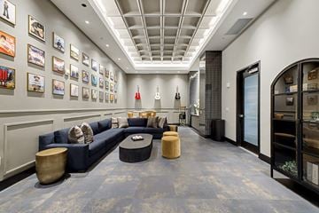 Nashville apartment for rent - A living room with a blue couch and a coffee table.