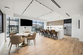 Nashville apartment for rent - A modern dining room with a long table and chairs.