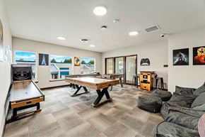 Arlington apartment for rent - A room with a pool table, a couch, and a TV.