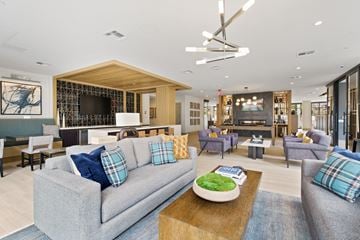 Medway apartment for rent - A modern living room with a grey couch and a wooden coffee table.