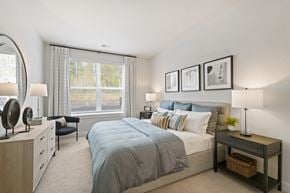 Medway apartment for rent - A bedroom with a large bed and a window with curtains.