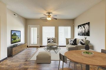 Lawrence apartment for rent - A living room with a wooden table and chairs.