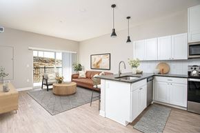 Cranberry Township apartment for rent - A modern kitchen with white cabinets and a large island.