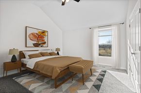 Spring Hill apartment for rent - A bedroom with a large bed and a painting on the wall.