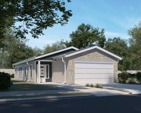 Lee's Summit apartment for rent - A modern house with a white garage door and a stone wall.