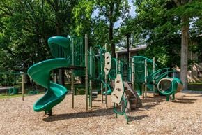Silver Spring apartment for rent - A playground with a green slide and climbing structures.
