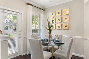 Woodlands apartment for rent - A dining room with a glass table and chairs.