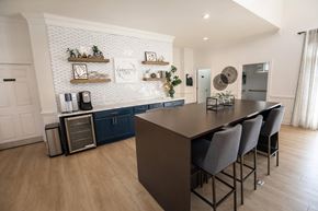Kernersville apartment for rent - A kitchen with a long table and chairs.