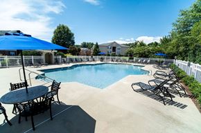 Anderson apartment for rent - A pool with a table and chairs around it.