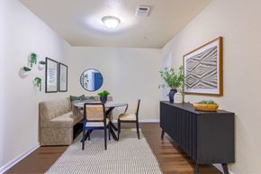 Hattiesburg apartment for rent - A dining room with a table and chairs.