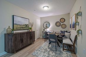 Goldsboro apartment for rent - A dining room with a wooden table and chairs.
