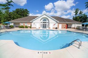 New Bern apartment for rent - A swimming pool in front of a house with a sign that says 5 FT 15M.