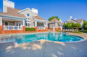 Chapel Hill apartment for rent - A house with a pool in front of it.