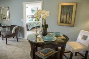 Roanoke apartment for rent - A dining room with a round table set for two.