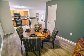 Wilson apartment for rent - A dining room with a table set for four.