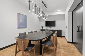 St. Louis Park apartment for rent - A modern dining room with a large table and chairs.