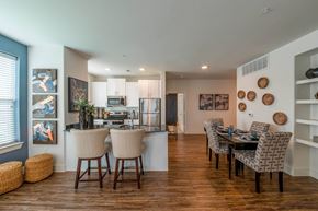 Dallas apartment for rent - A modern kitchen with a dining table set for four.