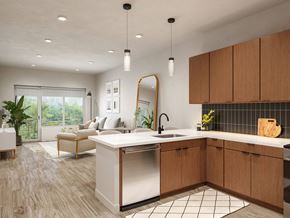 Parsippany apartment for rent - A modern kitchen with wooden cabinets and a large island.