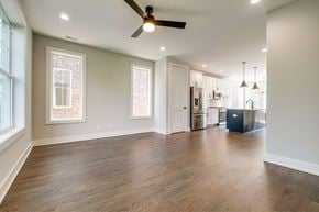 Nashville townhouse for rent - A spacious room with a ceiling fan and wooden flooring.